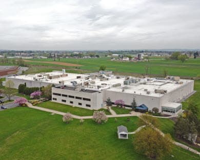 Exterior drone image of 1838 Colonial Village Ln, former J&J Building in Greenfield 